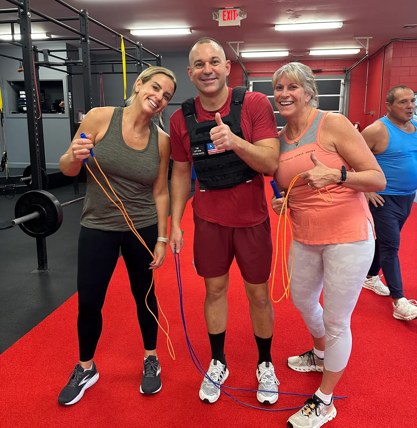 Members and a coach at The Lift Gym, all smiles after a jump-rope workout